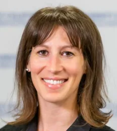 A woman in a black shirt, and a gray background