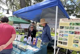 Ask A Master Gardener table volunteers John Fike Laura Brainin-Rodriguez and Greg Doyle