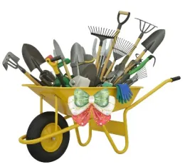Wheelbarrow full with variety of gardening tools, gardening glove and Christmas bow on front