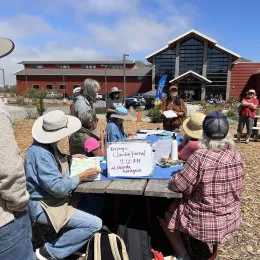 A group of gardeners in a class about nature journaling