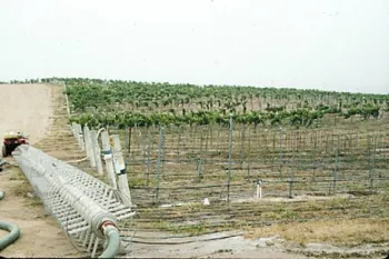 Water and product are delivered to each square foot of the field surface with portable soil drenching devices.