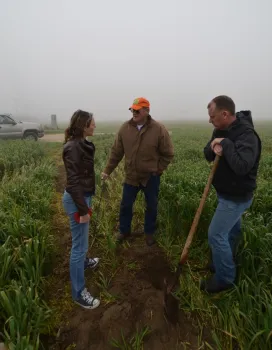 Amelie Gaudin discussing ecological practices with farmers.