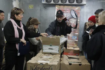 Ric Tombari, center, owner of Cooks Co. Produce, talks to growers about emerging trends in the produce business.
