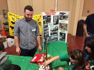 Kyle Lindstrom teaches children about the the Department of Ag Weights and Measures