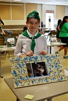 4-H Member showing off entry at Art and Design Day