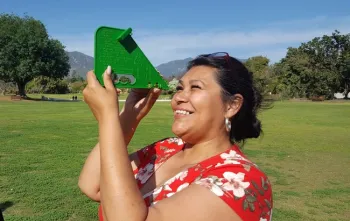 PLT Participant measuring a tree.