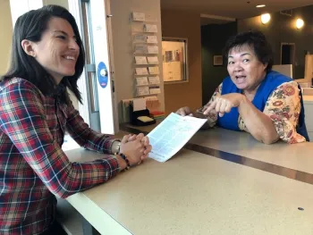 Master Gardener helping a client.