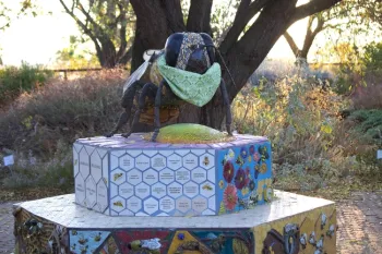 Bee statue at the Haven wearing a mask