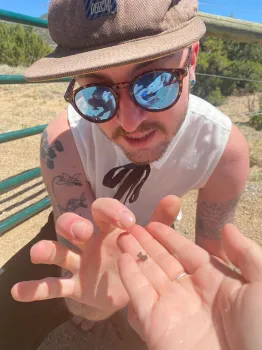 Ecologist Ash Semenick checks out an assassin bug found near Albuquerque, N.M. (Photo by Caroline Larsen-Bircher)