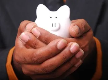 money piggy bank in hand sized