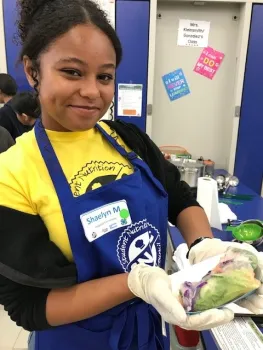 Youth participating in a hands-on food preservation activity