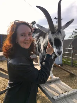 Rachel shown with a black & white goat.