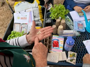 Master Food Preserver presenting a Basic Gardening class to low income and under-served families