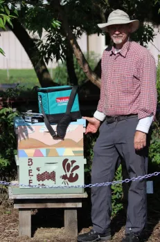 Rick installs bee hive display