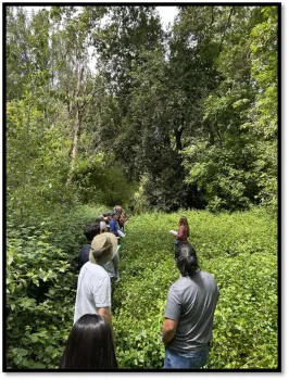 Dr. Shannon Lynch guides attendees through the infestation area.