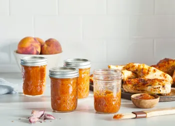Jars of Zesty Peach BBQ Sauce Photo Credit: Ballmasonjars.com