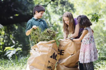 Children participating in an Earth Day cleanup event