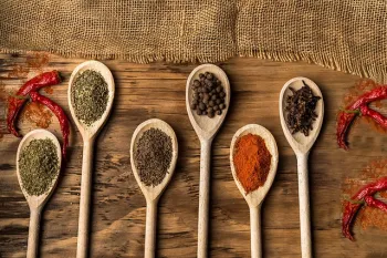 Wooden spoons with dried spices