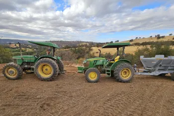 Tractor and machinery used to spread rock dust on fields at Sierra Foothill REC