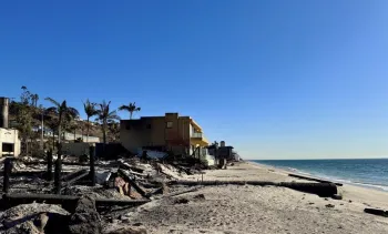 Aftermath of the Palisades fire, picturing a home on the beach that was burned by wildfire. 