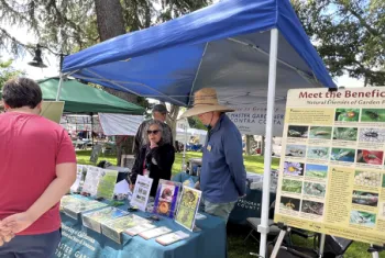 Ask A Master Gardener table volunteers John Fike Laura Brainin-Rodriguez and Greg Doyle