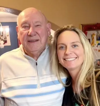Headshot of Allyn and his granddaughter