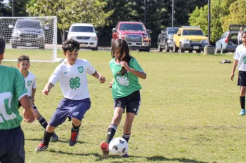 Youth playing soccer at the Roseland Field