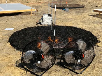 plots of compost ignited to research flame length, rate of flame spread, and radiant heat