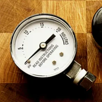 close up of analog pressure canner gauge
