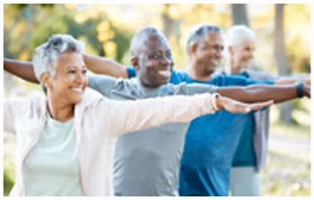 smiling people doing yoga outside