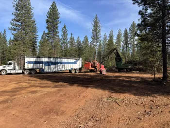 A chip van being loaded at a landing.