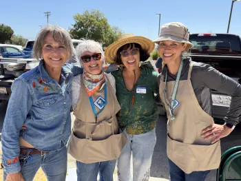 Four Master Gardener volunteers smile for a group photo at the Native Plant Boot Camp.