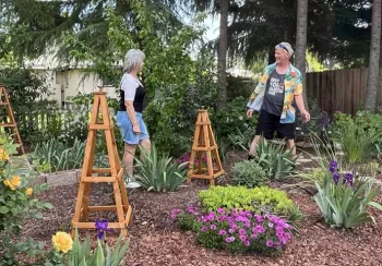 Two happy gardeners working in a garden