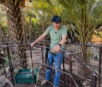 Candelario on a lift during his work day at the farm