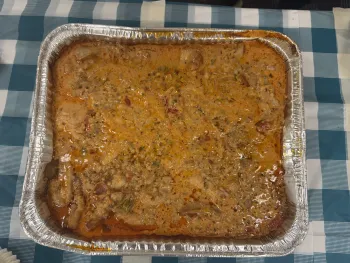 curry chicken in a large foil container
