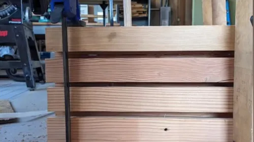 DLT with a dowel inserted through panels of wood