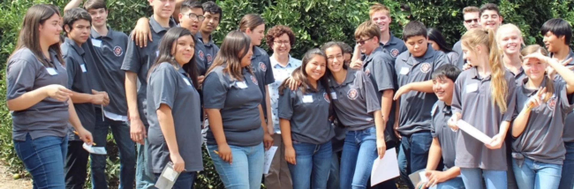 Woodlake High School student pose with Beth Grafton-Cardwell at the UC Lindcove Research and Extension Center near Exeter.