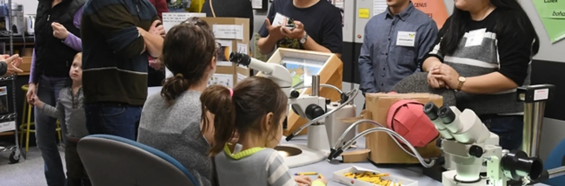 Fly researchers from the Joanna Chiu lab (back, from left) graduate student Yao Cai and undergraduate students Christopher Ochoa and Cindy Truong, talk to visitors. (Photo by Kathy Keatley Garvey)