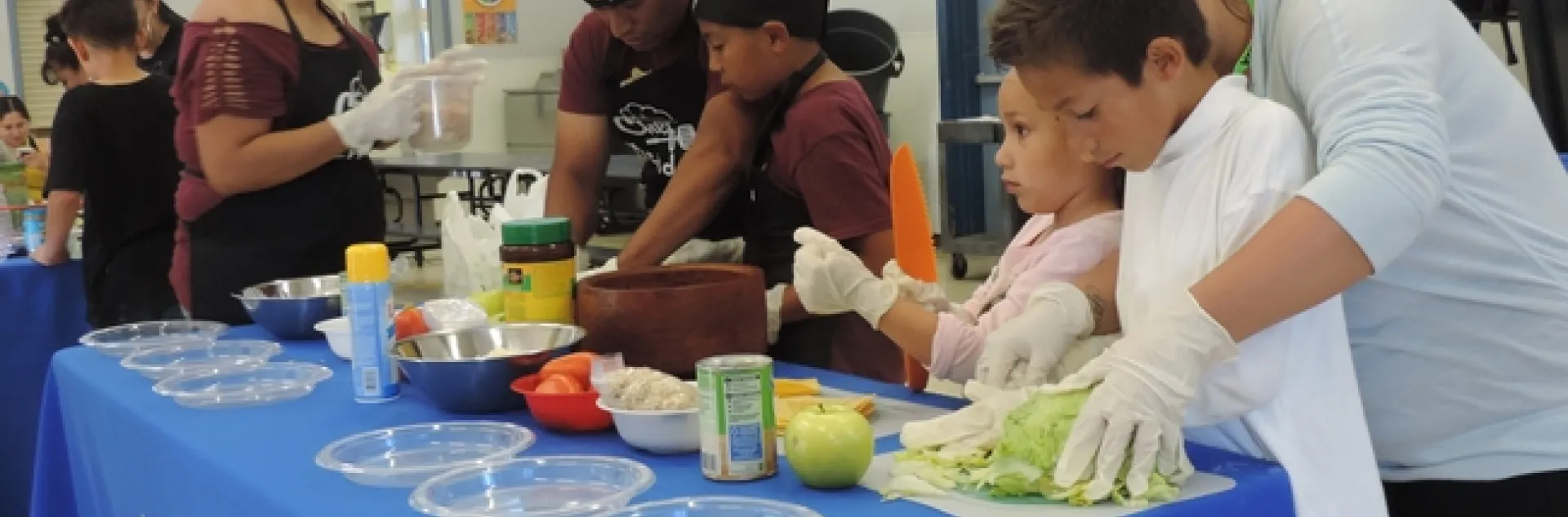 Families making special dishes for judges