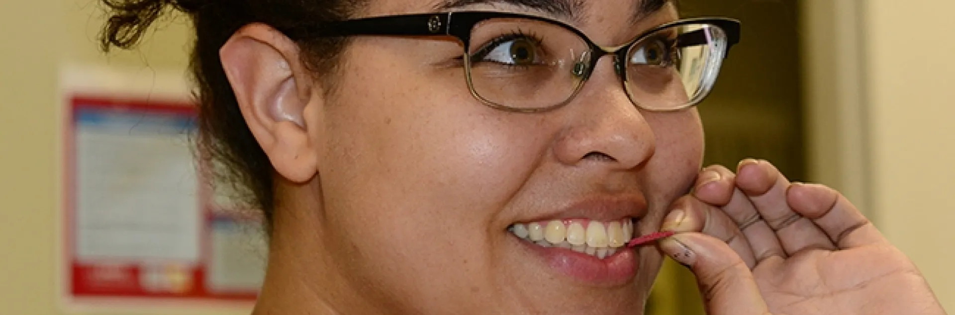 Biologist Iris Bright, a student at Sacramento City College and a volunteer at the Bohart Museum of Entomology, samples a red earthworm. (Photo by Kathy Keatley Garvey)