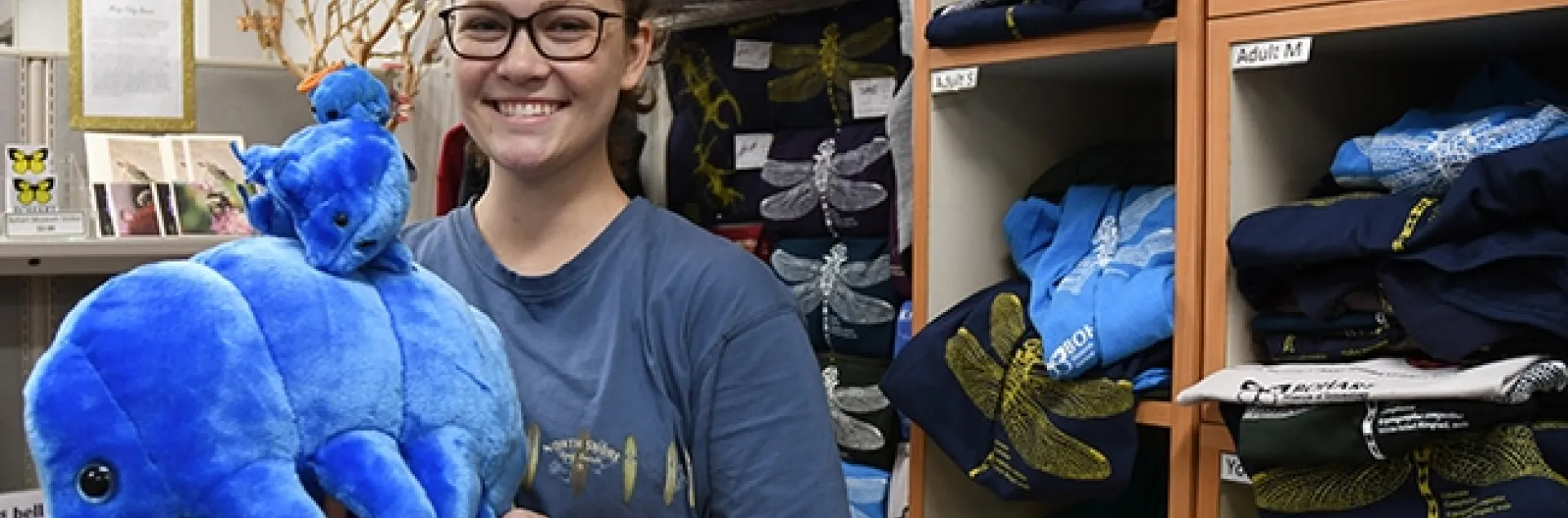 Entomologist Eliza Litsey, who received her bachelor's degree in entomology this year from UC Davis, shows some of the water bears (tardigrades) available in the Bohart Museum of Entomology gift shop. (Photo by Kathy Keatley Garvey)