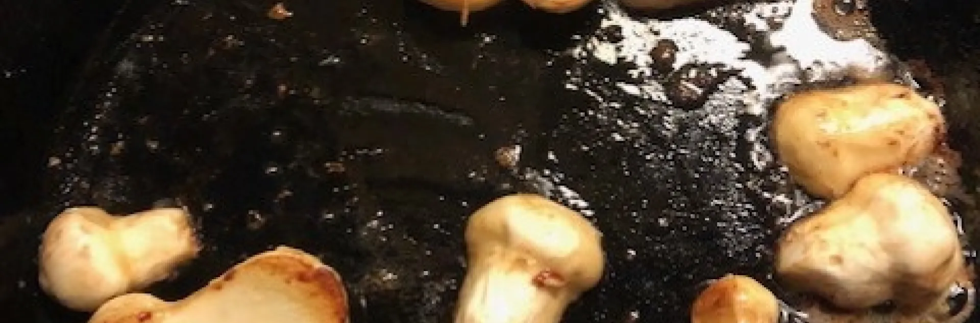 Fresh Matsutake mushrooms sauteéd golden brown.