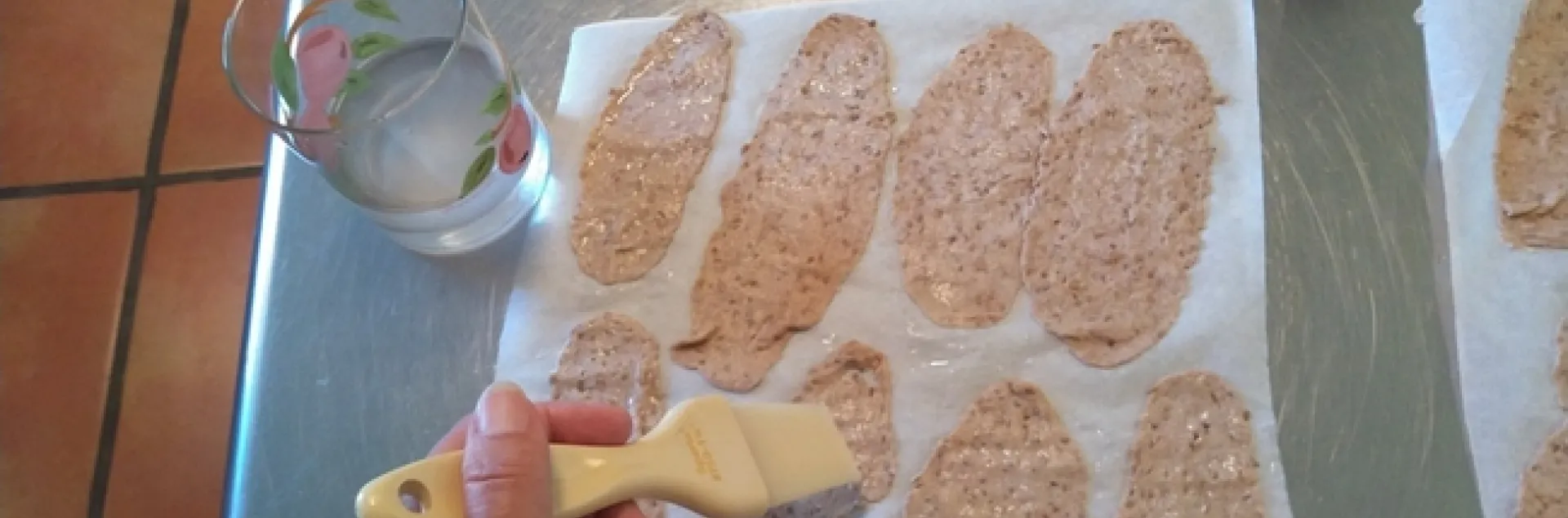 Brushing cracker dough with water(1)
