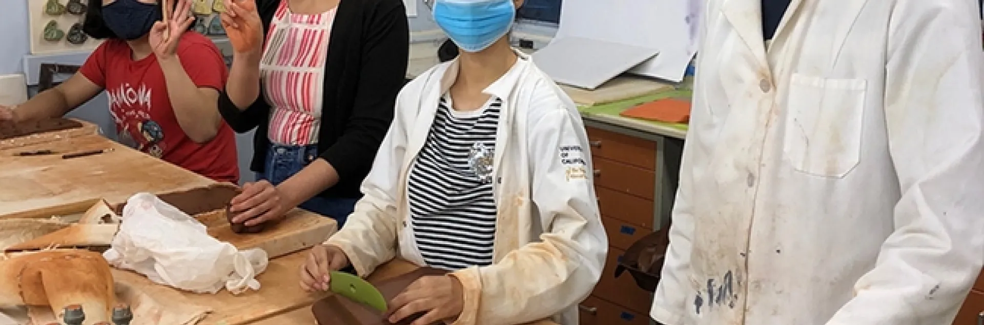 Working on clay molds are UC Davis students (from right to left) Ryan Meadows, Ashley Valdez, Heidi Tejeda Mata, and Imagine Morales.
