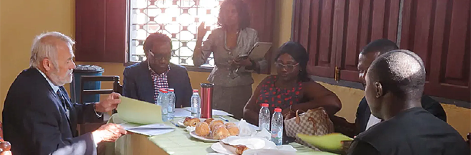 UC Davis distinguished professor James R. Carey (left foreground) brainstorms with other organizers of AgriStars. On his right is Prince Eyango.
