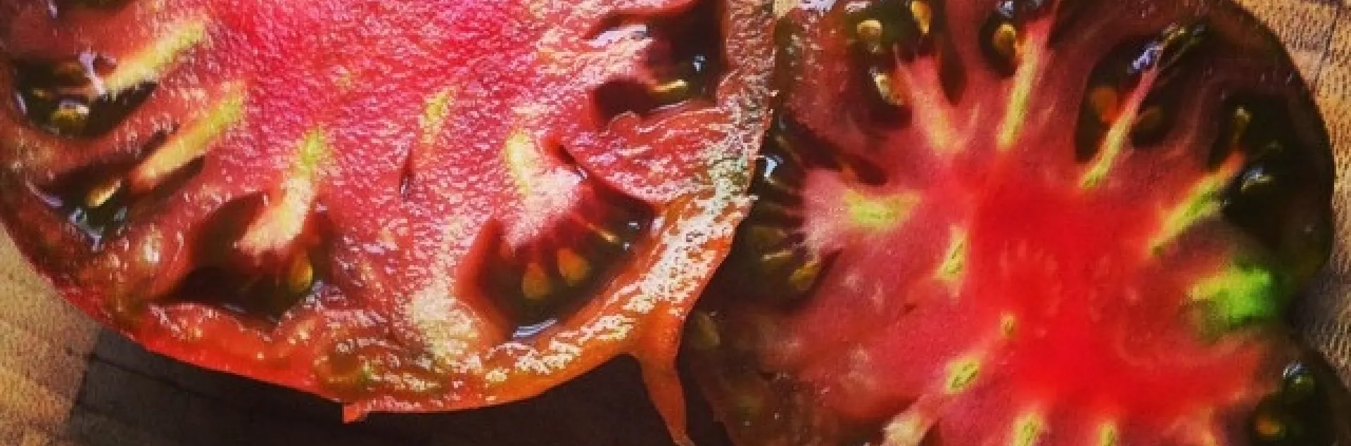 Black krim heirloom tomato from the garden mmmmmmm by xinem is licensed under CC BY 2.0.