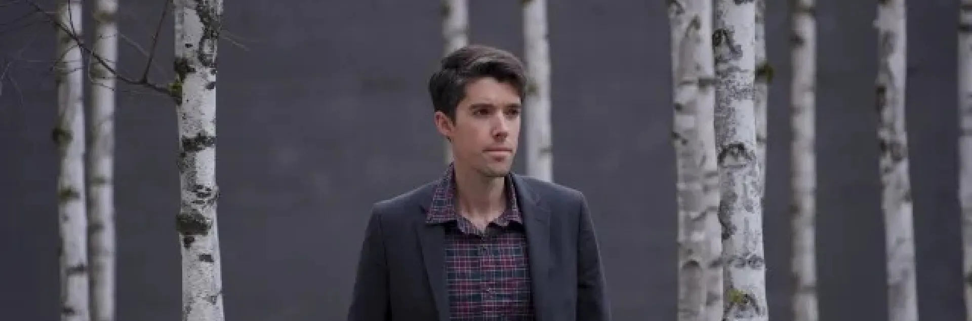 Daniel Swain in front of a backdrop of trees