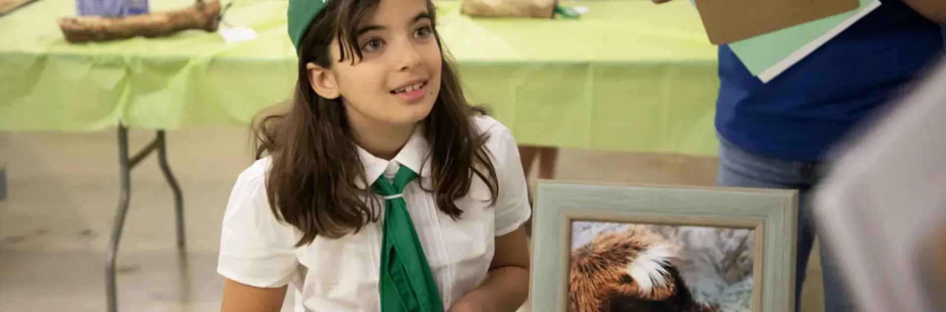 4-H member at display table for Art and Design Day