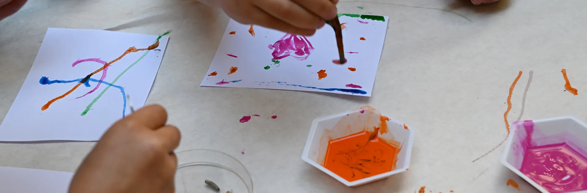 Artists work with maggots to create maggot art.