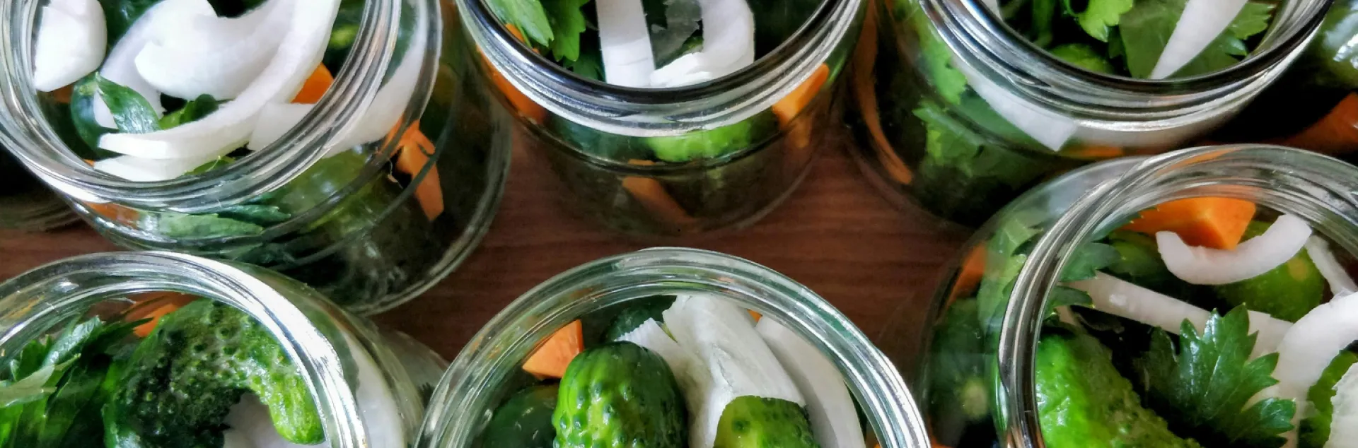 Pickles in a jar looking down from above